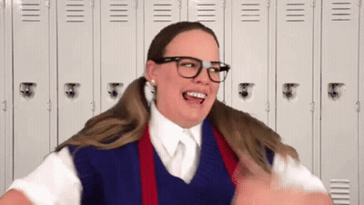 Woman In School Uniform Making Funny Face By Lockers GIF