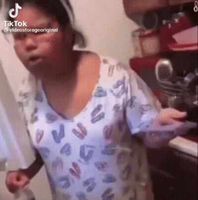 Woman In Scrub Top Holding Plate GIF