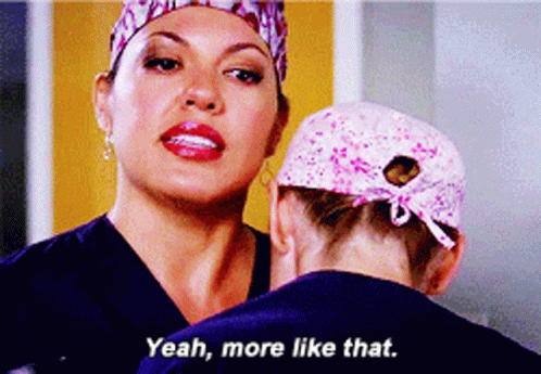 Woman In Scrubs Talking To Another Woman Saying Yeah More Like That GIF