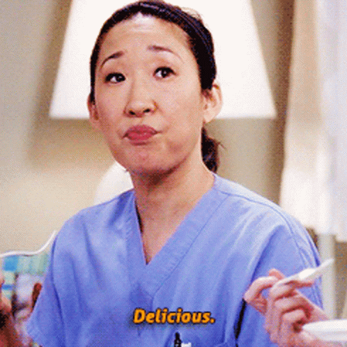 Woman In Scrubs With Delicious On Her Chest GIF
