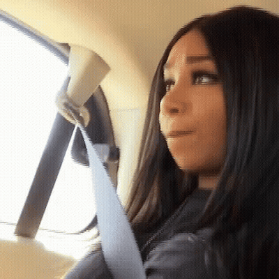 Woman In Seat Belt Looking Out Window GIF