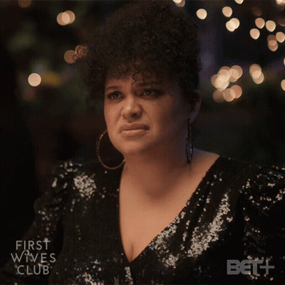 Woman In Sequined Dress Looks Sad GIF