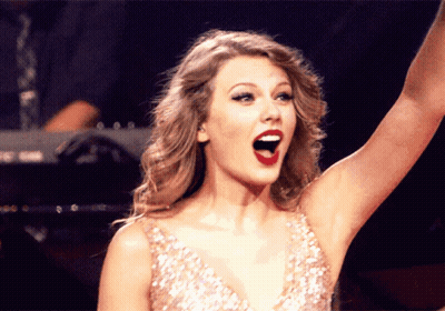 Woman In Sequined Dress Raising Arm GIF