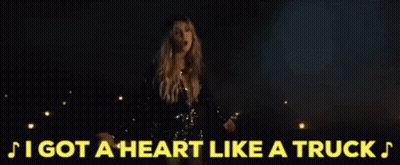 Woman In Sequined Dress Singing I Got A Heart Like A Truck GIF