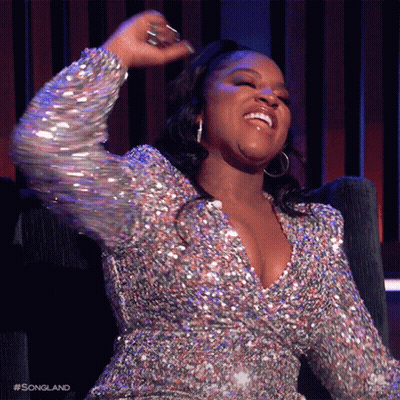 Woman In Sequined Dress Smiling Dancing GIF