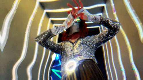 Woman In Sequined Jacket And Gloves With Blood On Hands GIF