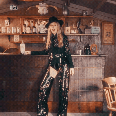Woman In Sequined Pants And Hat At Bar Saying I'm GIF