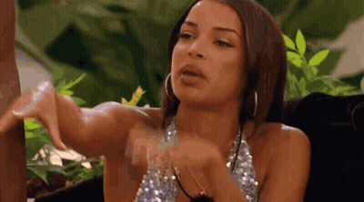 Woman In Sequined Top With Hoop Earrings And Hands Outstretched GIF