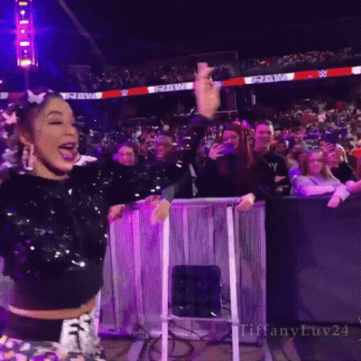 Woman In Sequined Top With Raw Sign GIF