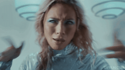 Woman In Silver Costume Making Funny Face GIF