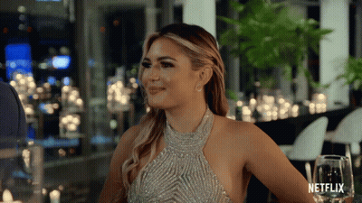 Woman In Silver Dress At Netflix Table GIF