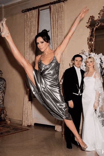 Woman In Silver Dress Doing Split GIF