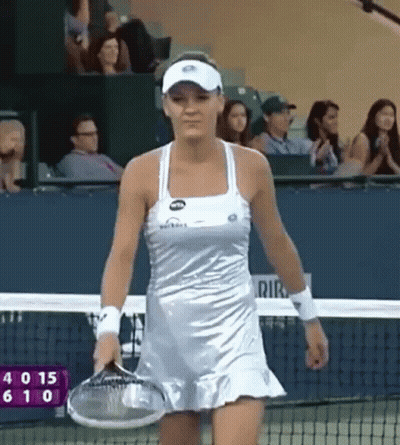 Woman In Silver Dress Holding Tennis Racket GIF