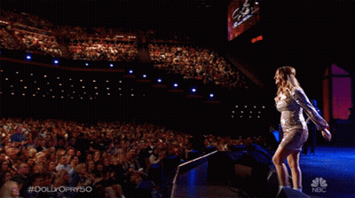 Woman In Silver Dress On NBC Stage GIF