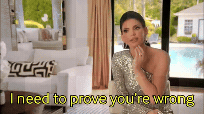 Woman In Silver Dress Saying I Need To Prove You're Wrong GIF