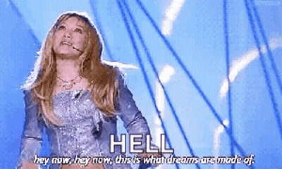 Woman In Silver Dress Says Hell Hey Now GIF