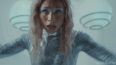 Woman In Silver Outfit With Angel Wings GIF