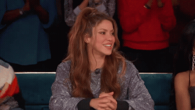 Woman In Silver Sweater Clapping In Crowd GIF