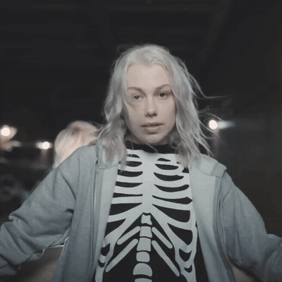 Woman In Skeleton Shirt And Blue Hoodie GIF