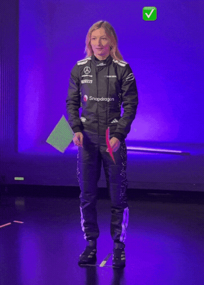 Woman In Snapdragon Jacket Holding Green Flag GIF