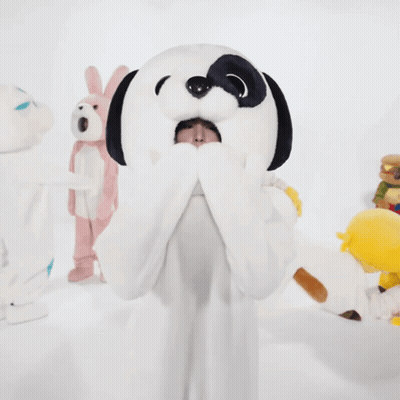 Woman In Snoopy Costume With Stuffed Animal On Head GIF