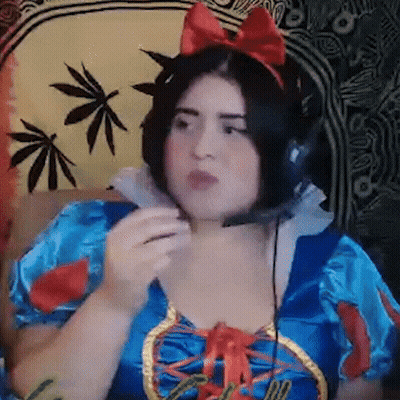 Woman in Snow White Costume With Headphones on Couch