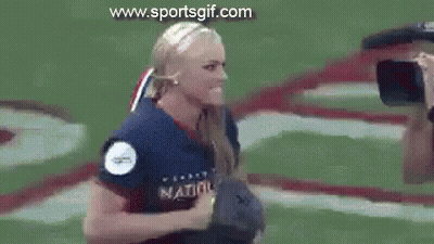Woman In Softball Uniform Holding Yellow Ball GIF