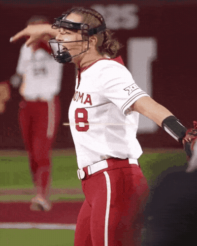 Woman In Softball Uniform Number 8 GIF