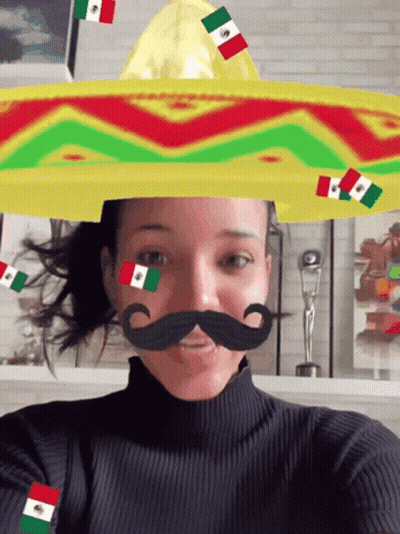 Woman In Sombrero And Fake Mustache With Flags GIF