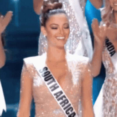 Woman In South Africa Sash Smiling On Stage GIF