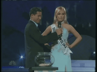 Woman In South Carolina Sash Beside Man GIF