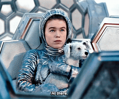 Woman In Space Suit Holding Dog Says Hi There GIF