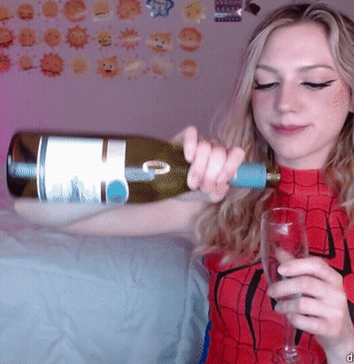 Woman In Spiderman Costume Pouring Wine GIF