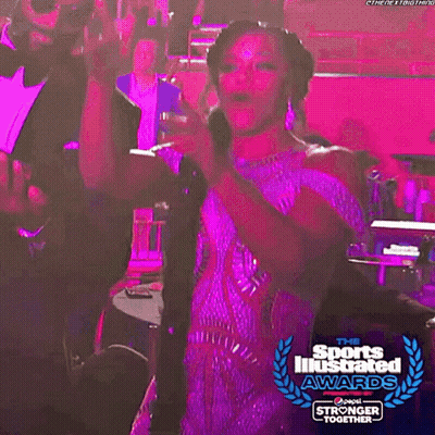 Woman In Sports Illustrated Awards Dress Dancing With Man In Suit GIF