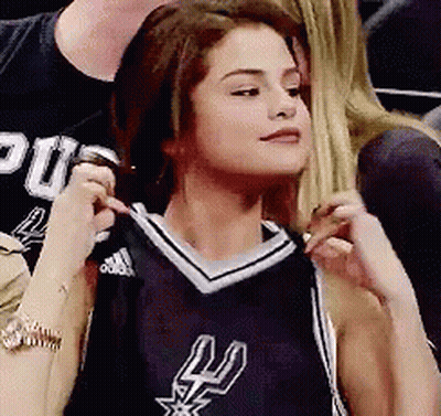 Woman In Spurs Jersey Sitting In Stadium GIF