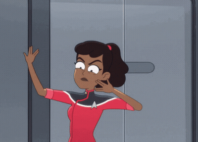 Woman In Star Trek Uniform In Doorway GIF
