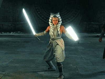 Woman In Star Wars Costume Holding Lightsaber GIF