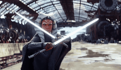 Woman In Star Wars Costume Holding Lightsabers GIF