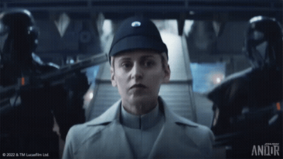 Woman In Star Wars Uniform Standing In Front Of Staircase GIF