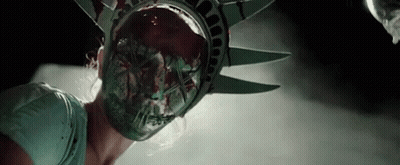 Woman In Statue Of Liberty Mask With Blood From Mouth GIF