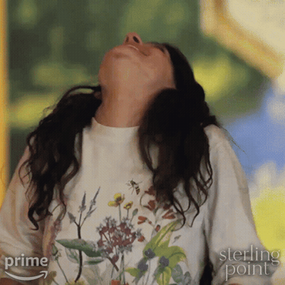 Woman In Sterling Point T-Shirt Looking Up GIF