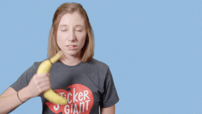 Woman In Sticker Giant Shirt Holding Banana GIF