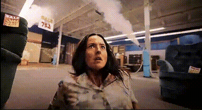Woman In Store With Sale Sign GIF