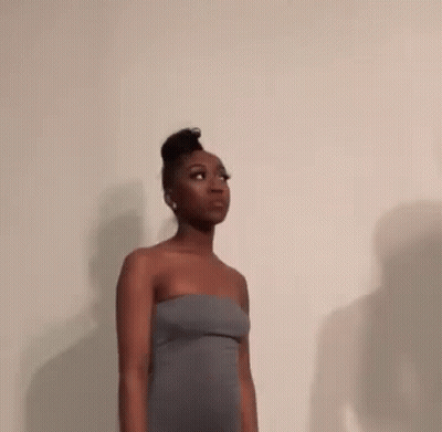 Woman In Strapless Dress Looking Up GIF