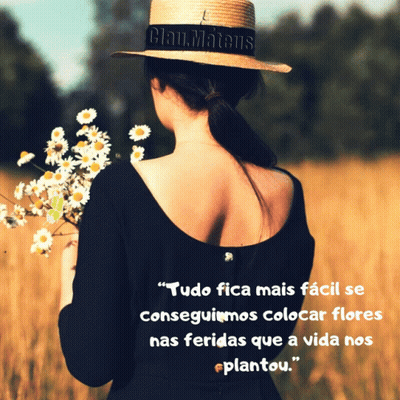 Woman In Straw Hat Holding Daisies In Field GIF