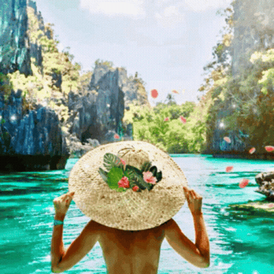 Woman In Straw Hat Standing In Water GIF