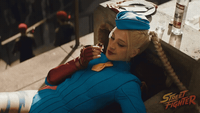 Woman In Street Fighter Costume On Balcony GIF