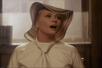 Woman In Striped Hat With Mouth Open GIF