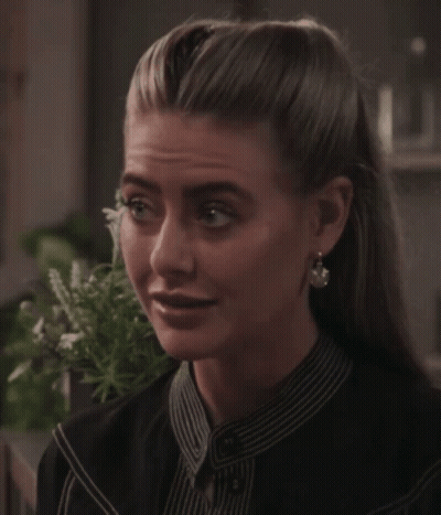 Woman In Striped Shirt And Earrings GIF