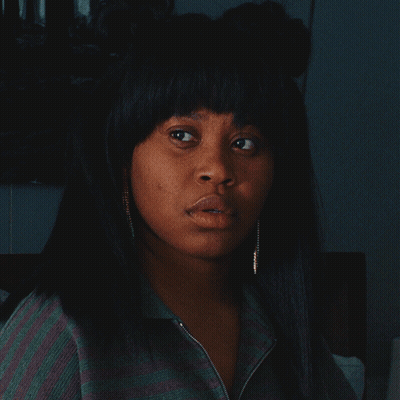 Woman In Striped Shirt And Earrings GIF